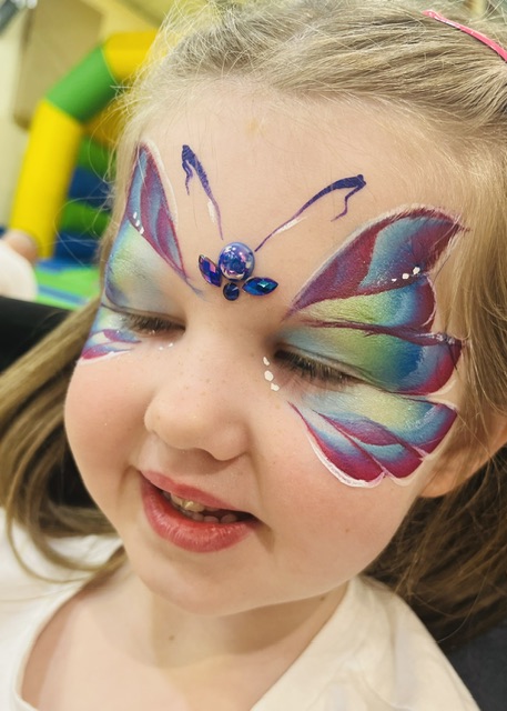 Girl with a butterfly face paint in Telford